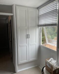 white fitted cupboard