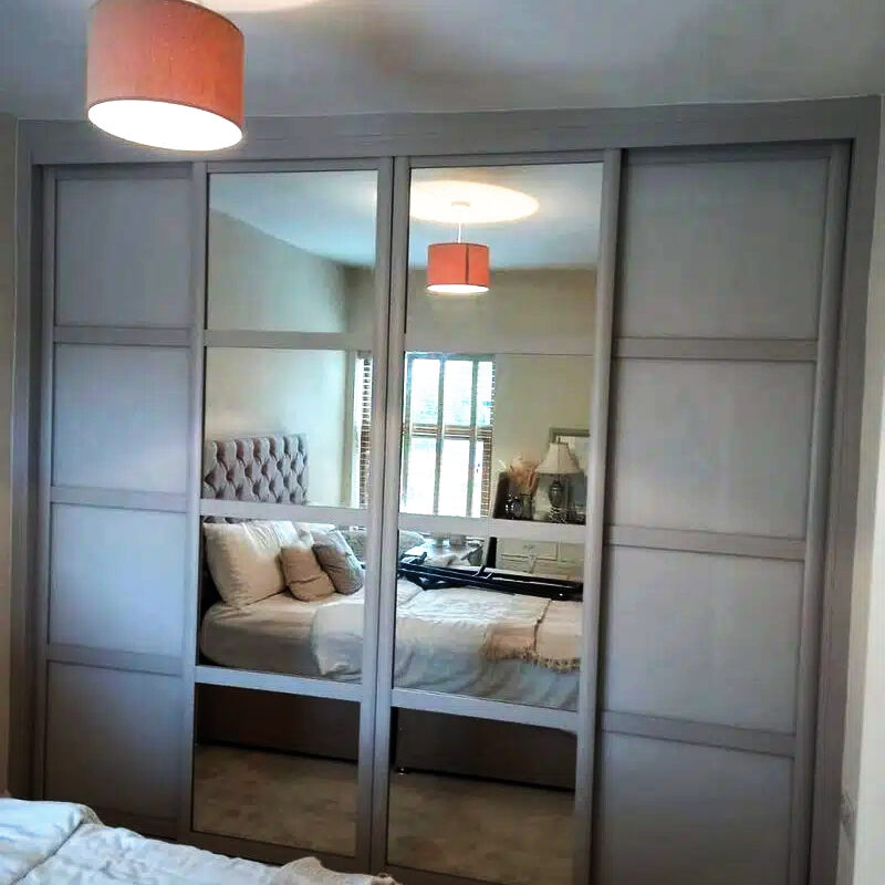 bespoke wardrobe with mirror sliding panelled doors